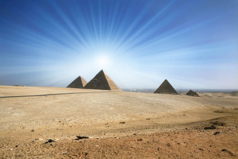 Light of the sun in the sky over the Great Pyramids of Giza.