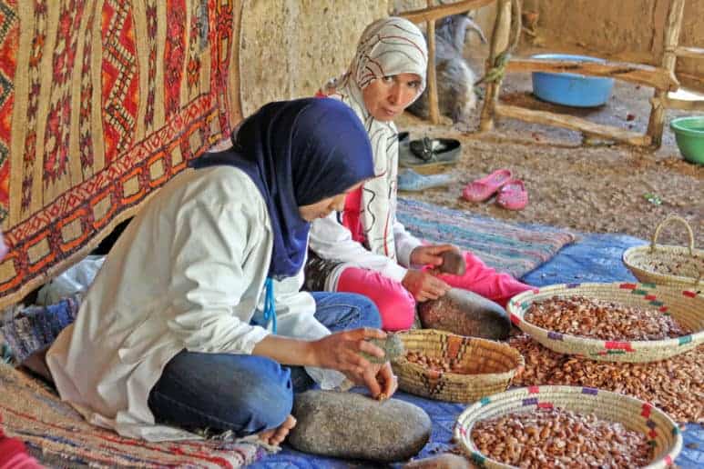 Women work in a cooperative for the manufacturing of argan fruits