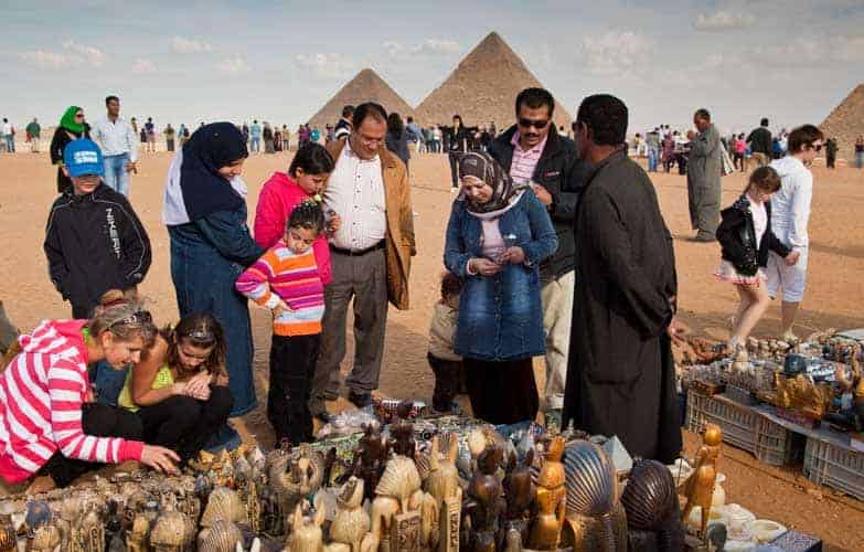 Travelers by the Great Pyramids - Photo Credit: Lonely Planet