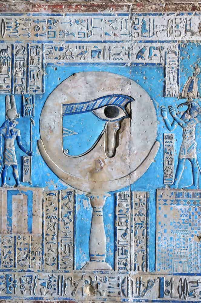 Beautiful painted relief of the sacred eye of horus at the ancient Egyptian temple of the goddess Hathor at Dendera, in Egypt